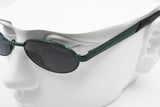 Vintage sunglasses ROLLING 786, Little oval sunglasses with green metallized metal, New Old Stock 1990s