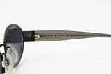 Les Copains sunglasses mod. LC 305 Size 53, Oval sunglasses darken gunmetal frame, New Old Stock 1990s