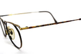 Vintage round eyeglasses TAXI hand crafted in ITALY mod. 244, adorned golden frame gunmetal effect, symbolis modern art , NOS 1980s
