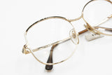 Rare and unique Yves Saint Laurent Paris mod. Hyre eyeglasses frame oval drop lenses, Golden main colour with White & Black details, NOS 70s