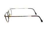 Vintage round eyeglasses TAXI hand crafted in ITALY mod. 244, adorned golden frame gunmetal effect, symbolis modern art , NOS 1980s